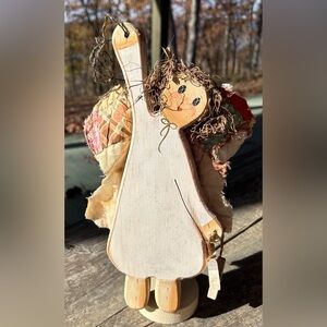 Vintage Angel wooden with aged quilted wings. Signed by artist.